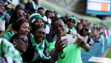 Nigeria's Uchenna Kanu takes a selfie with fans after the Canada match.