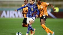 Japan's Mina Tanaka battles with Zambia's Agnes Musase.