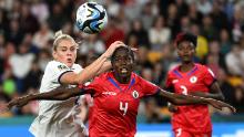 England's Alessia Russo and Haiti's Tabita Joseph fight for the ball during the two sides' opening game on July 22. England's Lionesses, the reigning European champions, earned a scrappy 1-0 victory over the tournament debutants.