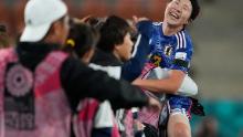 Japan's Jun Endo celebrates with her bench after scoring her team's fourth goal in a 5-0 win against Zambia on July 22.