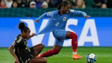 Jamaica's Atlanta Primus tugs the shirt of France's Grace Geyoro.