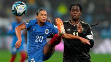 France's Estelle Cascarino, left, and Shaw battle for the ball.