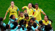 Colombia's Catalina Usme celebrates with teammates after scoring her team's first goal against South Korea on July 25. Colombia won 2-0.
