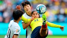 Usme tries to control the ball in front of South Korea's Kim Hye-ri.