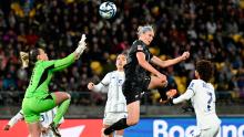 New Zealand's Hannah Wilkinson attempts to head the ball past Philippines goalkeeper Olivia McDaniel during their match on July 25.