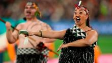 People in Indigenous dress perform during a welcome ceremony that was held before Norway-Switzerland.