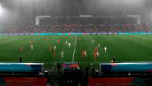 Rain pours down during the Norway-Switzerland match.
