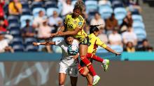 South Korea's Cho So-hyun, bottom left, competes for the ball against Colombia's Jorelyn Carabali and Carolina Arias.