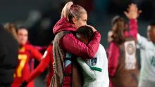 Spain's Alexia Putellas consoles Zambia's Mary Wilombe after the match. Zambia still has one match to play, but it will not be able to advance to the knockout stage.
