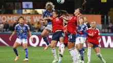 Japan's Mina Tanaka heads the ball toward the Costa Rican goal.