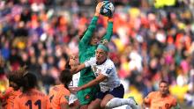 Dutch goalkeeper Daphne van Domselaar grabs the ball over the United States' Julie Ertz during their 1-1 draw on July 27.