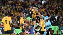 Players from Australia and Nigeria compete for a ball in the air on July 27.