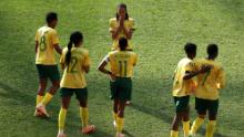 South Africa's Linda Motlhalo celebrates with teammates after scoring her team's first goal against Argentina. South Africa led 2-0 before Argentina's dramatic comeback.