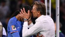France's coach Herve Renard kisses defender Wendie Renard on the forehead after her winning goal secured a 2-1 win against Brazil.
