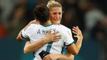 Ali Riley and Katie Bowen hug after New Zealand is knocked out of the Women's World Cup on Sunday.