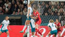 New Zealand's Katie Bowen clears the ball in front of Switzerland's Julia Stierli.