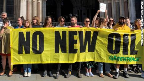 Protestors gather outside the Royal Courts of Justice in London on July 25, 2023, ahead of a legal challenge from climate campaign groups over the government&#39;s opening of a new round of oil and gas extraction licensing in the North Sea. Photo by Tom Pilgrim/PA Images via Getty Images. 