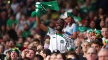 A fan shows support for the Nigerian team during the match in Brisbane, Australia.