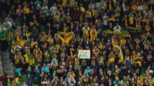 Australia fans in Melbourne celebrate after the Canada match.