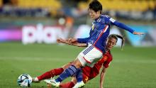 Japan's Hikaru Naomoto, top, and Spain's Ona Batlle compete for the ball.