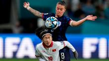 The Netherlands' Sherida Spitse, top, and Vietnam's Nguyễn Thị Thanh Nhã compete for the ball.