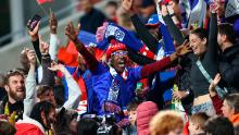 Haiti fans cheer their team at the stadium in Perth, Australia.
