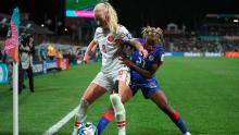 Denmark's Amalie Vangsgaard shields the ball from Haiti's Ruthny Mathurin.