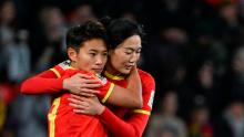 Chinese forward Wang Shuang, left, celebrates with Yang Lina after scoring against England.