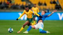 South Africa's Thembi Kgatlana tries to hold off Italy's Elena Linari.