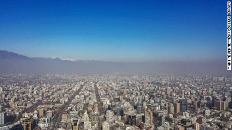 Aerial view of the city of Santiago showing the smog caused by high temperatures, taken on August 2, 2023. South American countries, such as Chile and Argentina, set heat records in the middle of the southern winter due to a combination of the El Niño phenomenon and climate change, which also impacts the northern hemisphere with record high temperatures, but in the summer. (Photo by MARTIN BERNETTI / AFP) (Photo by MARTIN BERNETTI/AFP via Getty Images)