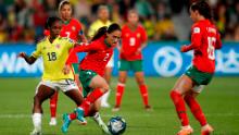 Colombian teenage star Linda Caicedo, left, challenges Morocco's Zineb Redouani during their final group match.