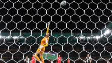 South Korean goalkeeper Kim Jung-mi dives for the ball during the match against Germany.