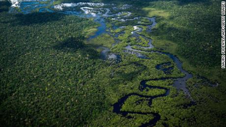 Aerial view of the Amazon rainforest taken from a plane flying from the city of Manicore to Manaus, Amazonas State, Brazil, on June 10, 2022. (Photo by Mauro PIMENTEL / AFP) (Photo by MAURO PIMENTEL/AFP via Getty Images)