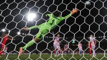 Japan's Ayaka Yamashita of Japan dives in vain to stop a Norway shot on goal.