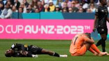 South Africa's Bambanani Mbane grimaces after colliding with the Netherlands' Lieke Martens. She was taken off on a stretcher shortly after.