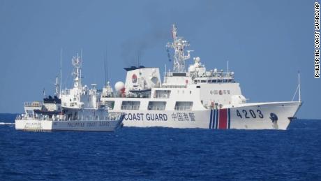In this June 30, 2023, photo provided by the Philippine Coast Guard, a Chinese Coast Guard ship, right, allegedly obstructs Philippine Coast Guard vessel Malabrigo as it provided support during a Philippine Navy re-supply mission near Second Thomas Shoal, South China Sea. (Philippine Coast Guard via AP)