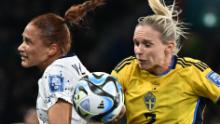 US forward Lynn Williams, left, and Sweden defender Jonna Andersson compete for the ball.