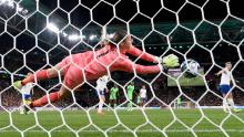 Earps makes a save against Nigeria.