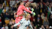 England's Chloe Kelly, bottom, celebrates with teammates Mary Earps, left, and Rachel Daly after scoring the winning penalty against Nigeria in the round of 16 on August 7. <a href="https://edition.cnn.com/2023/08/06/football/england-nigeria-australia-denmark-womens-world-cup-2023-spt-intl/index.html" target="_blank">The match went to a shootout</a> after ending 0-0.