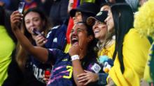 Colombia's Daniela Arias celebrates with fans on August 8 after her team defeated Jamaica 1-0 to progress to the quarterfinals.