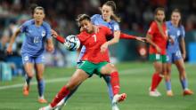 Morocco's Ghizlane Chebbak and France's Sandie Toletti compete for the ball.