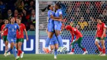 French midfielder Kenza Dali, left, celebrates with teammate Kadidiatou Diani against Morocco.