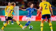 Japan's Risa Shimizu dribbles the ball during the match against Sweden.