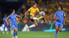 Australia's Mary Fowler controls the ball between France's Sakina Karchaoui and Wendie Renard.
