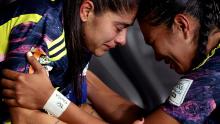 Colombia's Catalina Usme and Daniela Arias are dejected after the loss to England on Saturday, August 12.