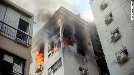 A building is ablaze following rocket attacks from the Gaza Strip, in Tel Aviv, Israel October 7, 2023.