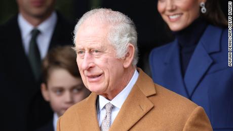 Britain&#39;s King Charles III waits on the church steps after attending the Royal Family&#39;s traditional Christmas Day service at St Mary Magdalene Church on the Sandringham Estate in eastern England, on December 25, 2023. (Photo by Adrian DENNIS / AFP) (Photo by ADRIAN DENNIS/AFP via Getty Images)