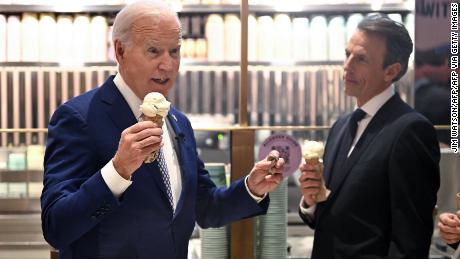 US President Joe Biden speaks with host Seth Meyers as they enjoy an ice cream at Van Leeuwen Ice Cream after taping an episode of &quot;Late Night with Seth Meyers&quot; in New York City on February 26, 2024. (Photo by Jim WATSON / AFP) (Photo by JIM WATSON/AFP via Getty Images)