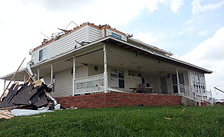 Melvin Sexton's home lost its roof in the storm.