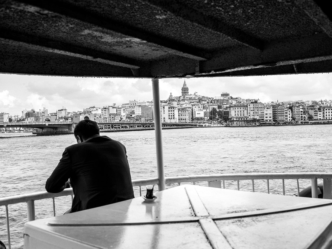 A man rides a ferry across the Bosphorus. Photographer Furkan Temir says many people tend to stay home in the immediate aftermath of terror attacks.